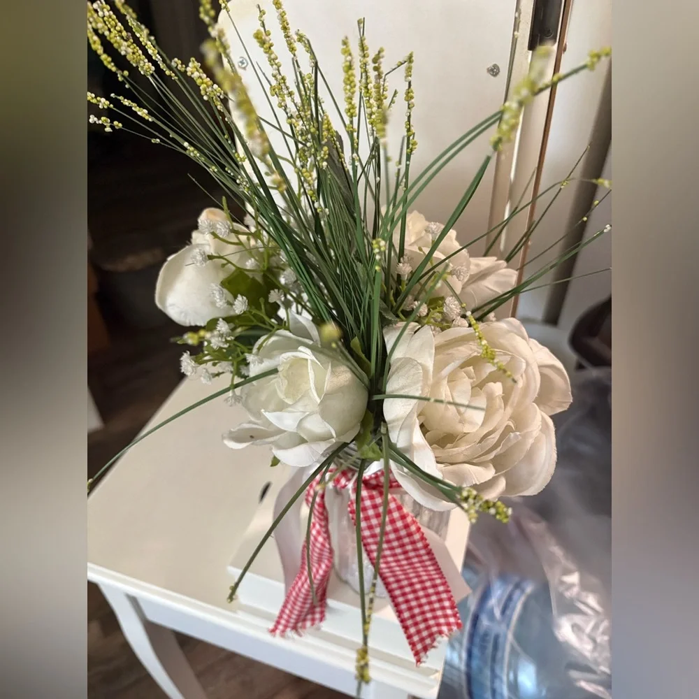 White Floral Arrangement in Glass Jar with Red & White Ribbon